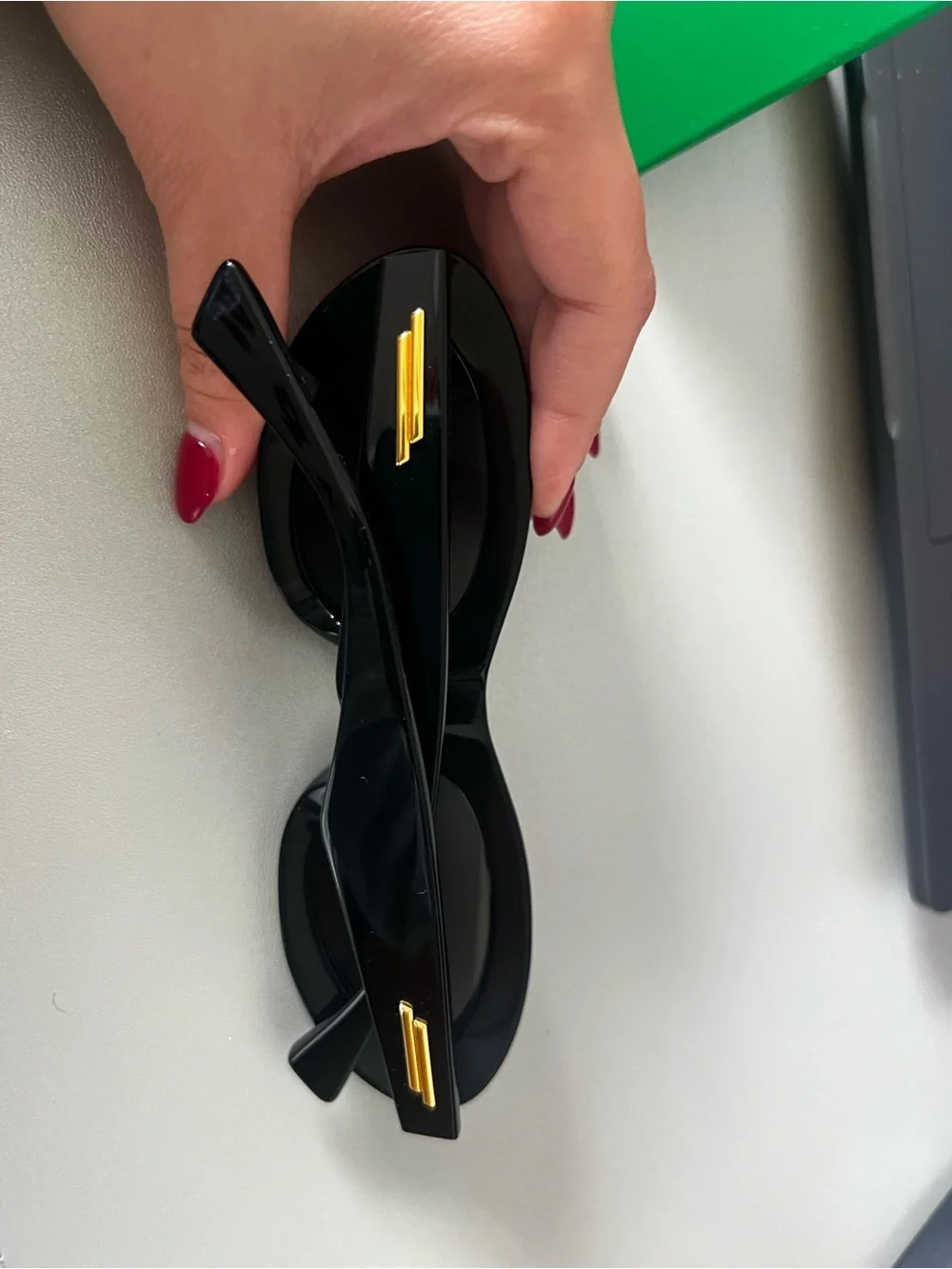 Bottega Veneta Black Oval Sunglasses with Dark Lenses
